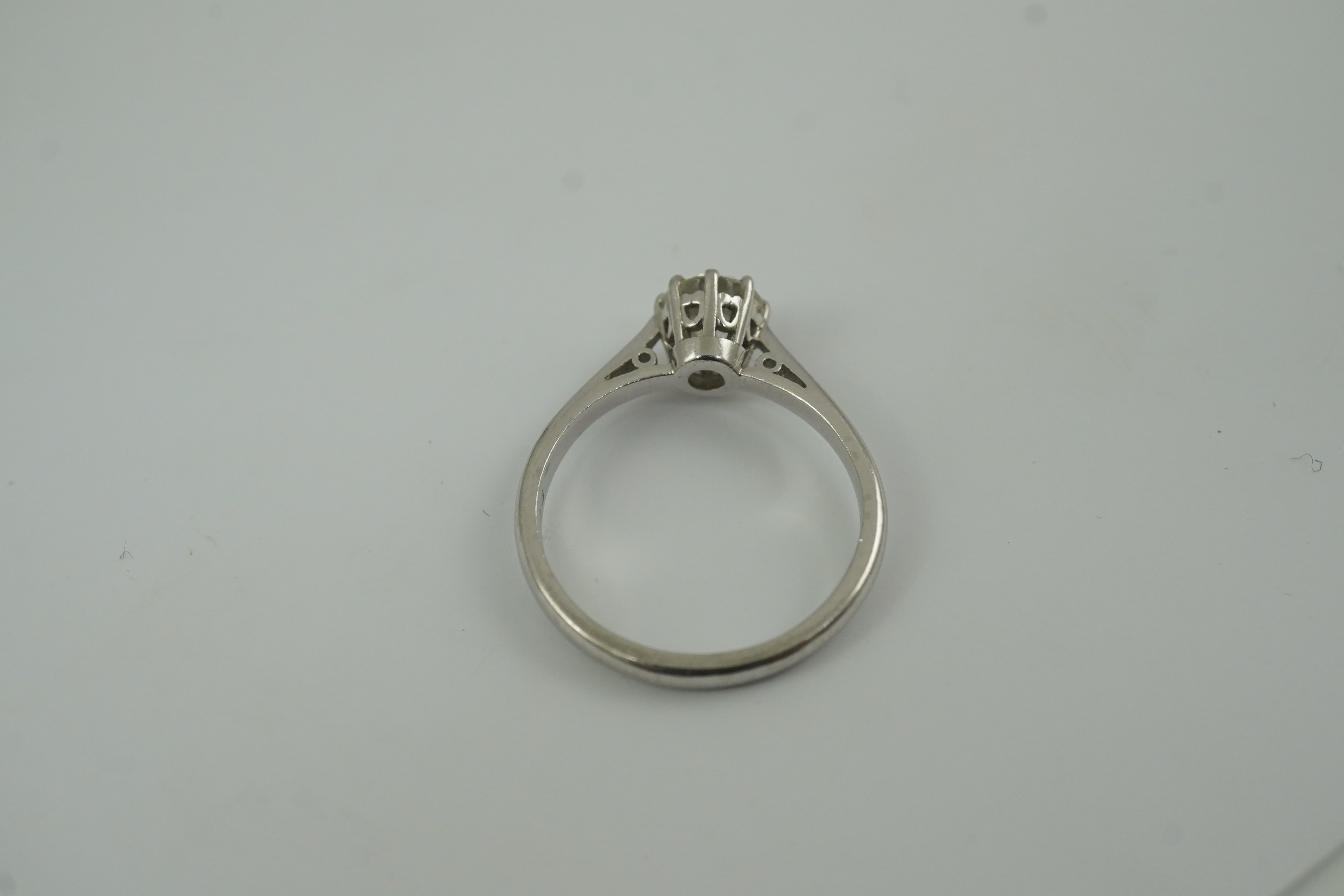 A modern platinum and solitaire diamond set ring